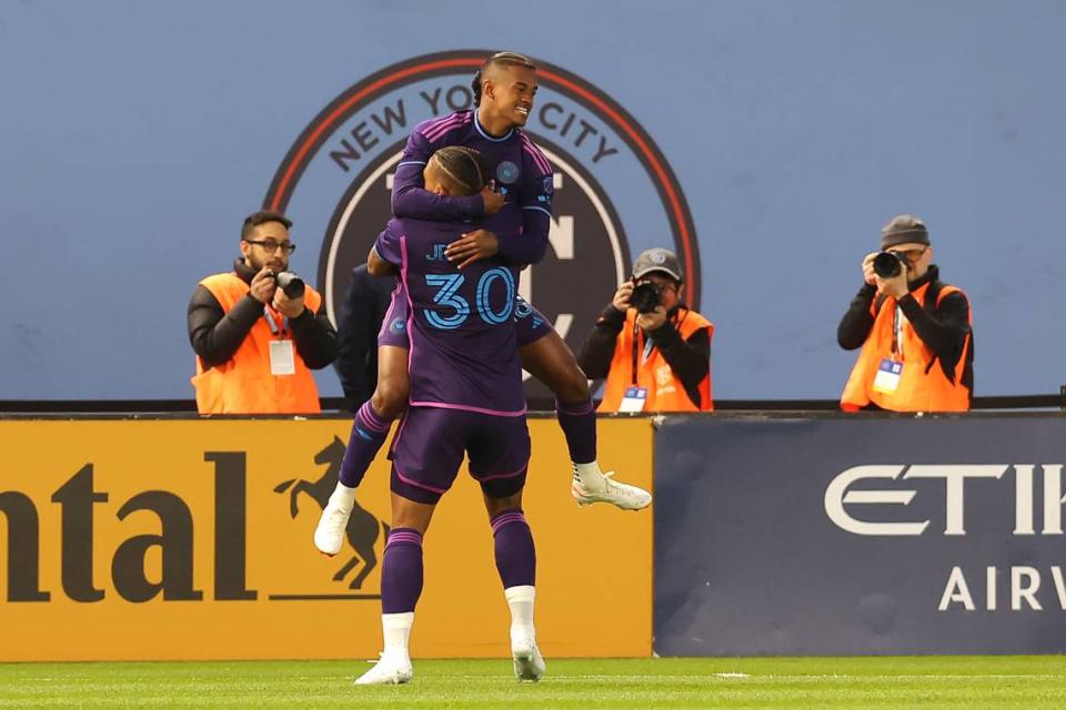 Charlotte FC forward Kerwin Vargas (18) celebrates his goal against New York City FC with midfielder Junior Urso (30) during Saturday’s first half.