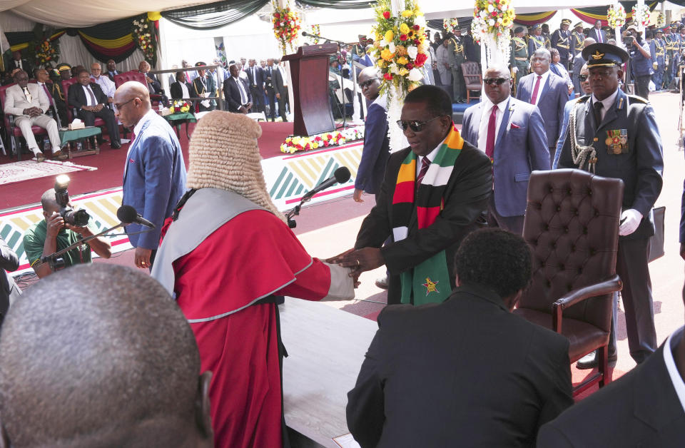 Zimbabwe President Emmerson Mnangagwa takes his oath, during his inauguration ceremony at the National Sports Stadium in the capital, Harare, Monday, Sept. 4 2023. Mnangagwa won a second and final-five year term in another disputed poll in the politically and economic troubled southern African nation. (AP Photo /Tsvangirayi Mukwazhi)