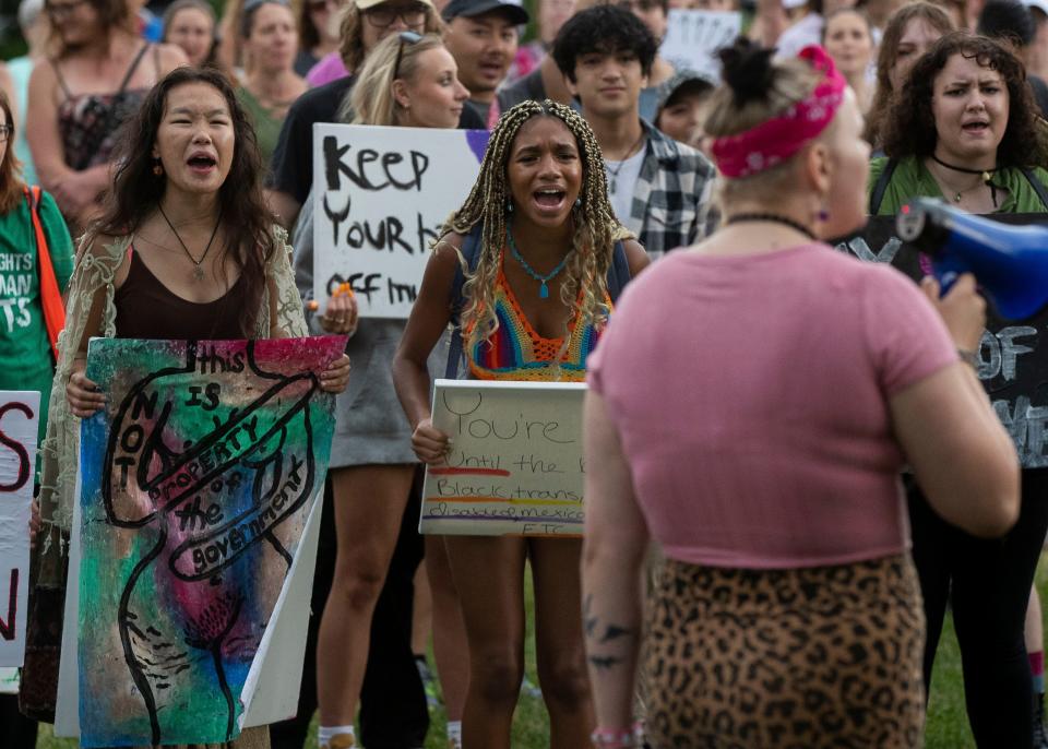 Leo Thao, left, and Olly Barton, right, shout in a call-and-response chant on Sunday at the 400 Block in Wausau. A march was held in protest of the recent U.S. Supreme Court decision overturning Roe vs. Wade and turning the decision of whether to allow abortions over to state legislatures.