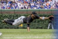 Jun 9, 2018; Chicago, IL, USA; Pittsburgh Pirates second baseman Sean Rodriguez (3) attempts to catch a ground ball hit by Chicago Cubs center fielder Ian Happ (not pictured) during the fourth inning at Wrigley Field. Mandatory Credit: Patrick Gorski-USA TODAY Sports