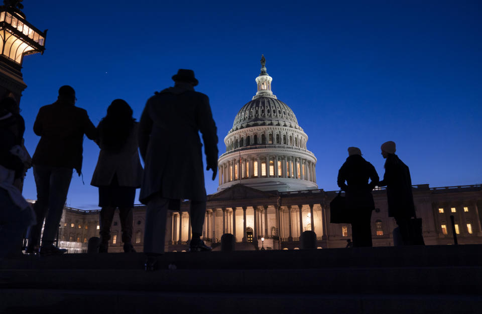 Night falls on the Capitol, in Washington, Wednesday evening, Jan. 22, 2020, during in the impeachment trial of President Donald Trump. House prosecutors are outlining what they refer to as President Donald Trump's “corrupt scheme” to abuse power and obstruct Congress as they open six days of arguments in his impeachment trial. (AP Photo/J. Scott Applewhite)