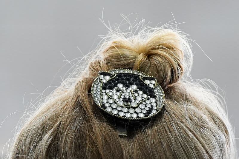 A handler wears a dog hair pin at the 148th Westminster Kennel Club dog show, Tuesday, May 14, 2024, in New York. | Julia Nikhinson