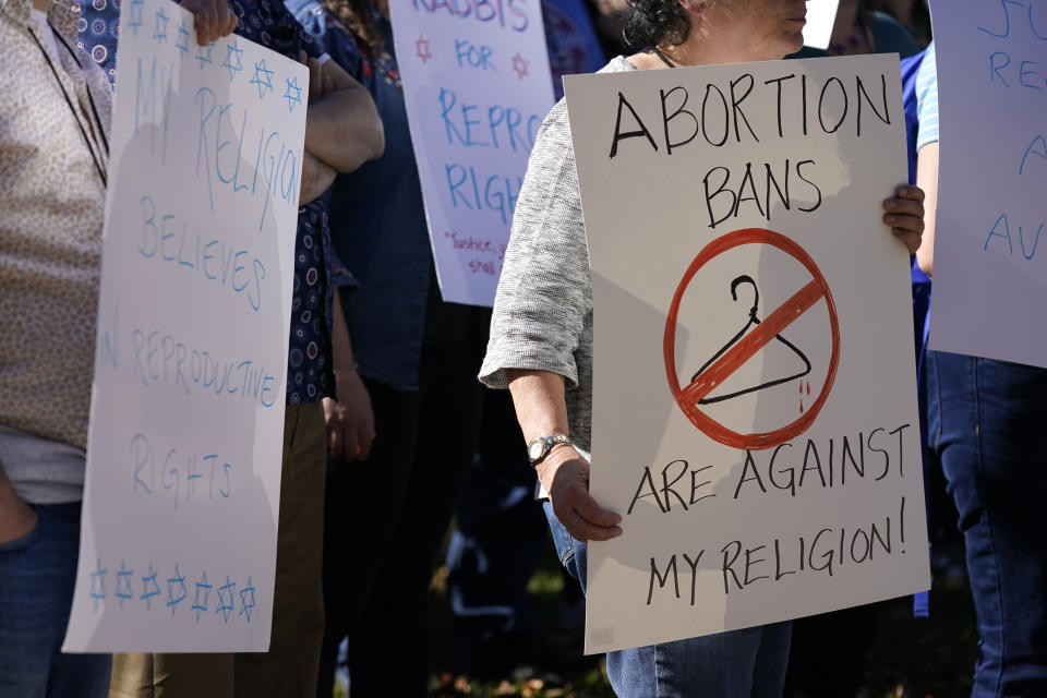 Rabbis and supporters from around the country gather for a rally, one day after the midterm elections, to show their support for protecting abortion rights Wednesday, Nov. 9, 2022, in Clayton, Mo. Participants in the rally advocated that abortion access is established by Jewish law and fundamental to religious freedom. (AP Photo/Jeff Roberson)