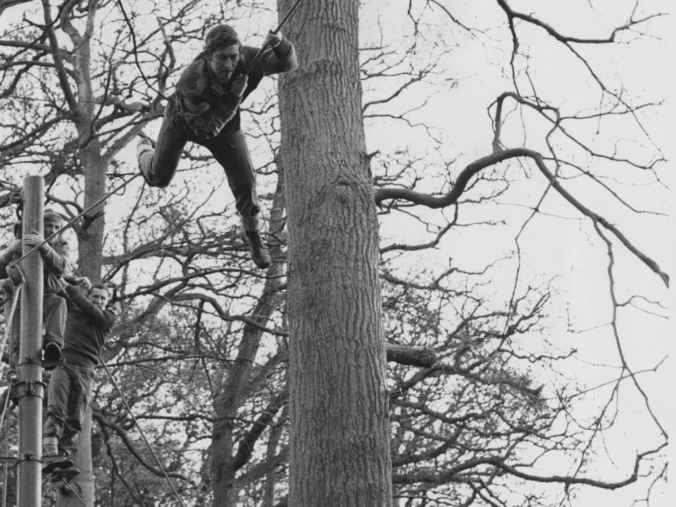 Prince Charles, the Prince of Wales tackles an assault course at the Royal Marines Training Centre in Lympstone, Devon, and achieves a first-class pass, 13th January 1975.