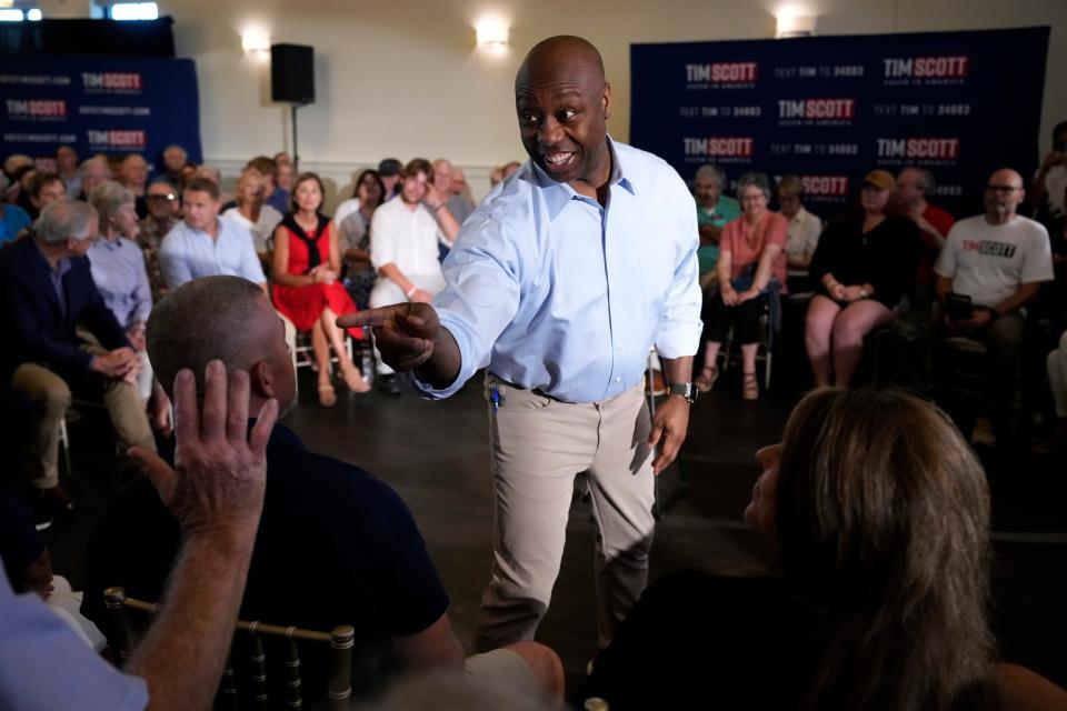 Republican presidential candidate Sen. Tim Scott, R-S.C., greets audience members during a town hall meeting, Thursday, July 27, 2023, in Ankeny, Iowa.