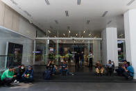 Food delivery riders awaiting their next order outside the Avenue K shopping mall in Kuala Lumpur on 18 March 2020, the first day of the Movement Control Order. (PHOTO: Fadza Ishak for Yahoo Malaysia)