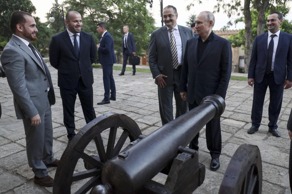 FILE - Russian President Vladimir Putin, foreground right, accompanied by Dagestan Gov. Sergei Melikov, center left, visits the Naryn-Kala fortress in Derbent, Russia, during his working visit on June 28, 2023. Jews in the predominantly Muslim region of Dagestan in southern Russia say they are determined to regroup and rebuild following a deadly attack by Islamic militants on June 23 on Christian and Jewish houses of worship in Derbent and the regional capital of Makhachkala. (Gavriil Grigorov, Sputnik, Kremlin Pool Photo via AP, File)