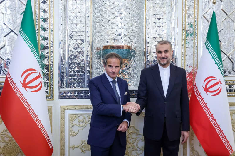 Iranian Foreign Minister Hossein Amir-Abdollahian (R) welcomes International Atomic Energy Agency (IAEA) Director General Rafael Mariano Grossi (L) before their meeting in Tehran. Iranian Foreign Ministry/ZUMA Press Wire/dpa