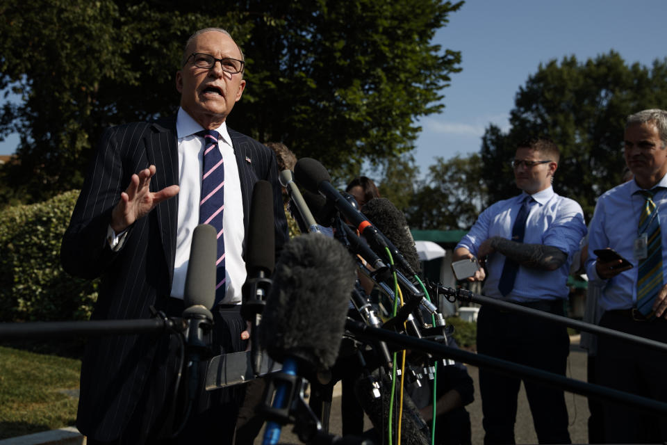 White House chief economic adviser Larry Kudlow talks with reporters outside the White House, Tuesday, Aug. 6, 2019, in Washington. (AP Photo/Evan Vucci)
