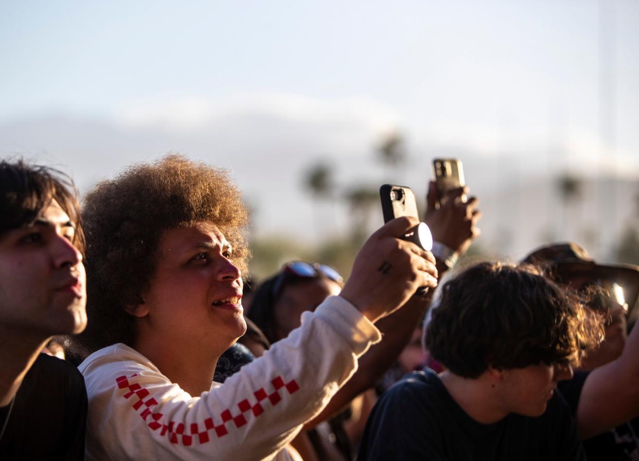 Festivalgoers watch as Sublime performs on the Coachella Stage during the Coachella Valley Music and Arts Festival in Indio, Calif., Saturday.
