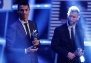 Soccer Football - The Best FIFA Football Awards - London Palladium, London, Britain - October 23, 2017 Real Madrid’s Cristiano Ronaldo and Barcelona’s Lionel Messi after being selected in the FIFA FIFPro World 11 during the awards REUTERS/Eddie Keogh