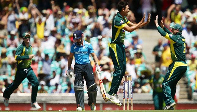 Mitchell Starc celebrates with team mates after taking the wicket of England's James Taylor.