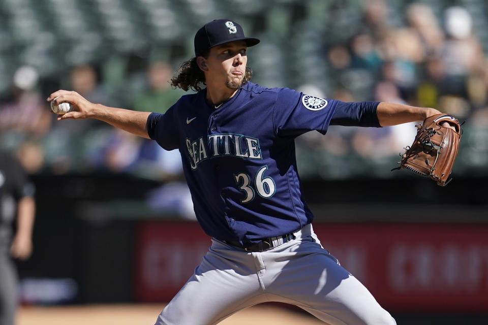 Seattle Mariners' Logan Gilbert pitches against the Oakland Athletics during the first inning of a baseball game in Oakland, Calif., Saturday, Aug. 20, 2022. (AP Photo/Jeff Chiu)