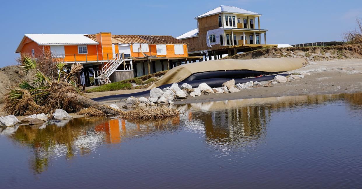 A sand-filled tube known locally as "the burrito" has protected Grand Isle, Louisiana, from the worst of storm erosion, but Hurricane Ida blasted through portions of it, inundating sections of the island with sand and seawater.