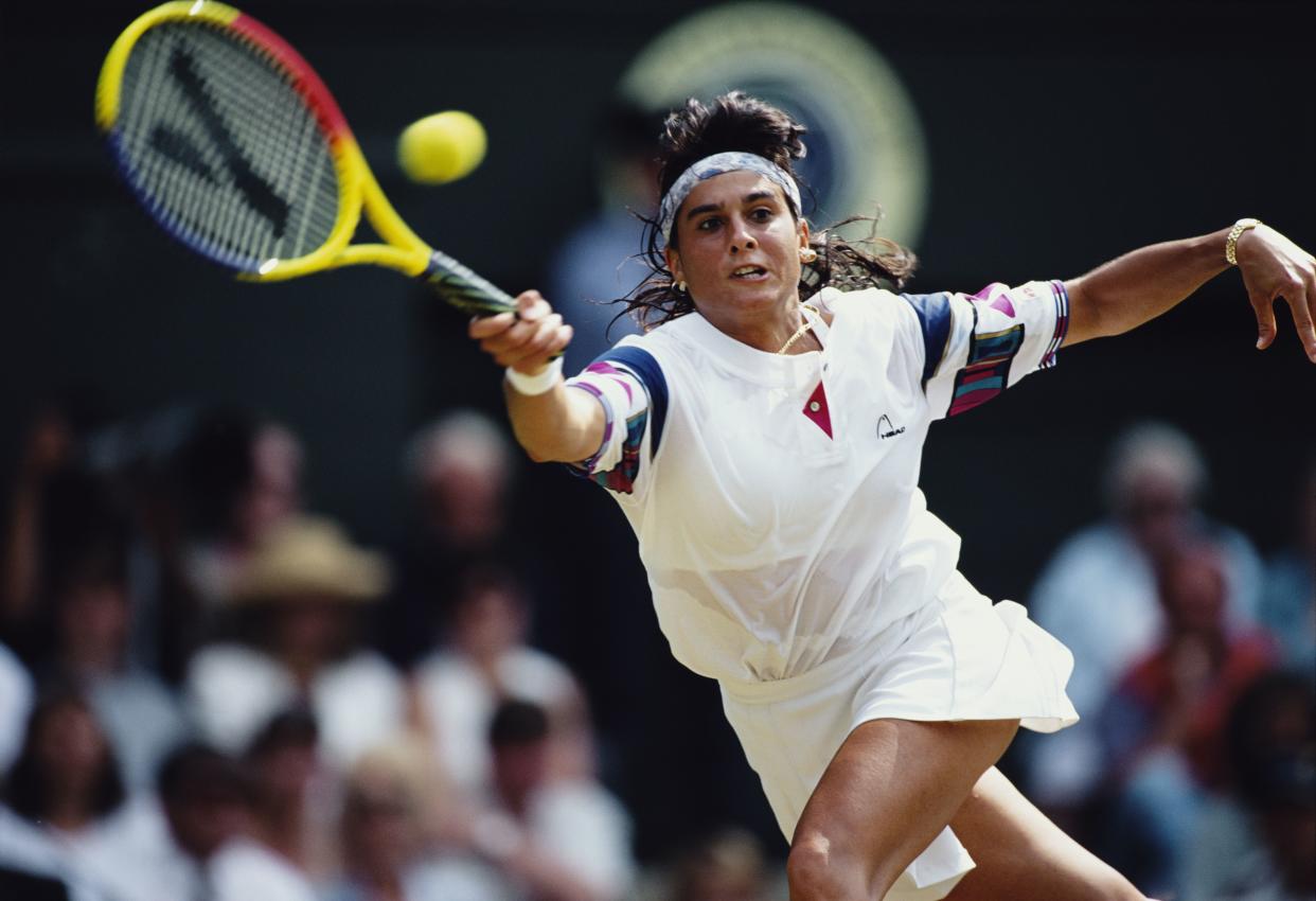 Gabriela Sabatini of Argentina reaches to make a forehand return against Lisa Raymond during their Women's Singles fourth round match at the Wimbledon Lawn Tennis Championships on 4 July 1995