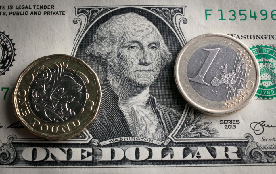 BATH, ENGLAND - OCTOBER 13:  In this photo illustration, a £1 coin is seen a US dollar bill and 1 euro coin on October 13, 2017 in Bath, England. Currency experts have warned that as the uncertainty surrounding Brexit continues, the value of the British pound, which has remained depressed against the US dollar and the euro since the UK voted to leave in the EU referendum, is likely to fluctuate.  (Photo Illustration by Matt Cardy/Getty Images)