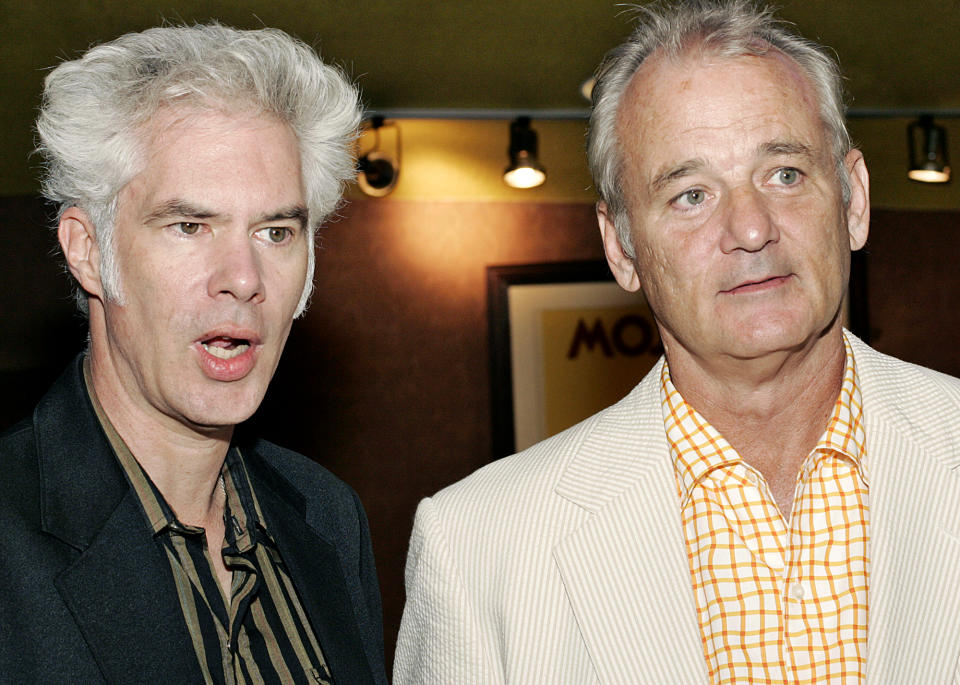 FILE - In this July 27, 2005 file photo, actor Bill Murray, right, stands with film director Jim Jarmusch, left, at the premiere of "Broken Flowers," in New York. Murray and Jarmusch have made three films together, starting with the 2003 black-and-white vignette anthology “Coffee and Cigarettes” and followed by the 2005 drama “Broken Flowers,” a high point for both, in which Murray played “an over-the-hill Don Juan.” They’ve now reunited again in “The Dead Don’t Die,” Jarmusch’s wry but impassioned zombie tale. Murray plays the veteran sheriff of a small town called Centerville populated by Jarmusch regulars. (AP Photo/Stephen Chernin, File)