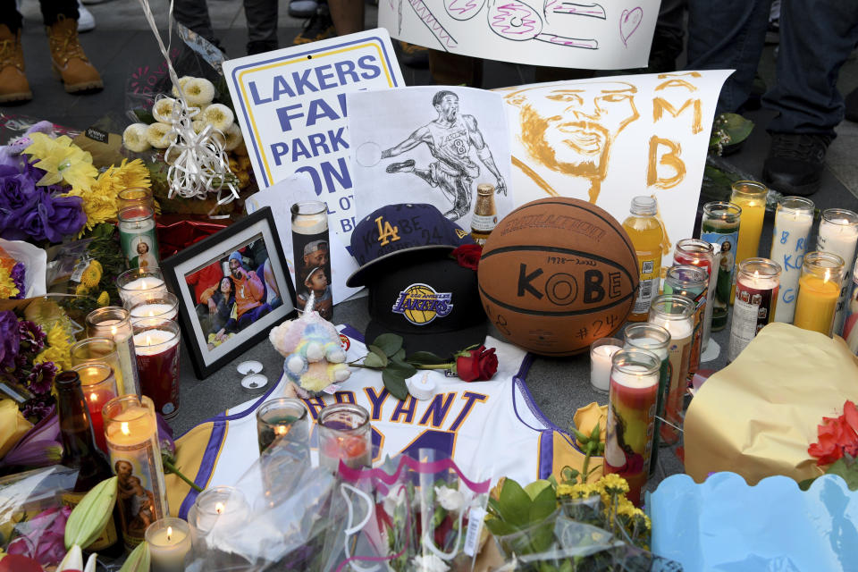 A memorial near Staples Center after the death of Laker legend Kobe Bryant Sunday, Jan. 26, 2020, in Los Angeles. (AP Photo/Michael Owen Baker)