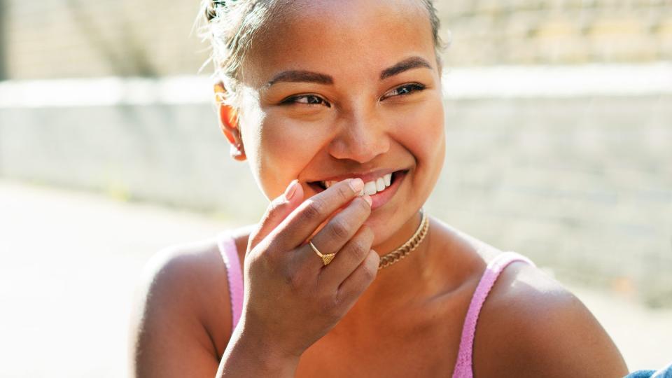 teeth-whitening-mistakes: woman with white teeth smiling