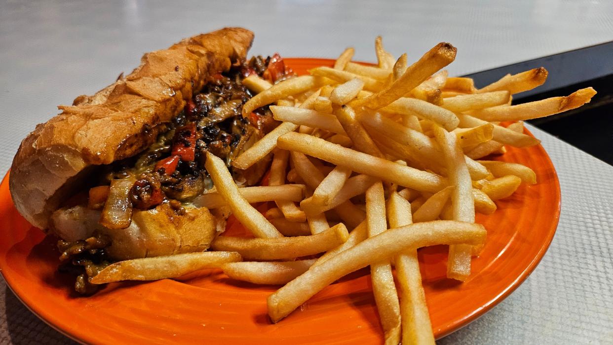 The Break Arcade sells its flagship “Break Steak,” a quarter-pound cheesesteak with onions, peppers and barbecue sauce alongside fries and a 16-ounce drink, for $5.98.