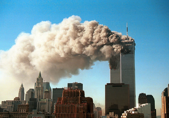 Smoke billows from the North Tower of the World Trade Center after a plane crash on 9/11