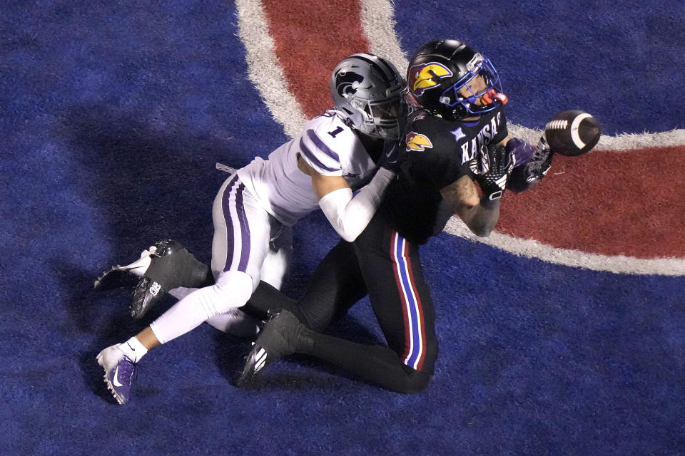 Kansas State cornerback Keenan Garber (1) breaks up a pass intended for Kansas wide receiver Lawrence Arnold during the first half of an NCAA college football game Saturday, Nov. 18, 2023, in Lawrence, Kan. (AP Photo/Charlie Riedel)