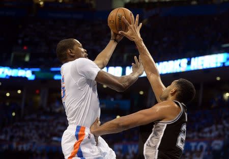 May 6, 2016; Oklahoma City, OK, USA; Oklahoma City Thunder forward Kevin Durant (35) shoots the ball over San Antonio Spurs center Tim Duncan (21) during the first quarter in game three of the second round of the NBA Playoffs at Chesapeake Energy Arena. Mandatory Credit: Mark D. Smith-USA TODAY Sports
