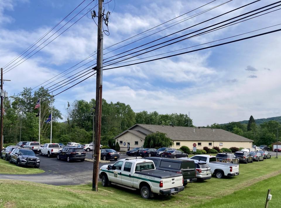 Federal, state and local law enforcement gathered at the Pennsylvania State Police barracks west of Warren on Saturday amid the massive manhunt for Michael C. Burham, who escaped from the Warren County Prison on Thursday. The barracks is located just outside of Warren on Route 6 in Conewango Township.