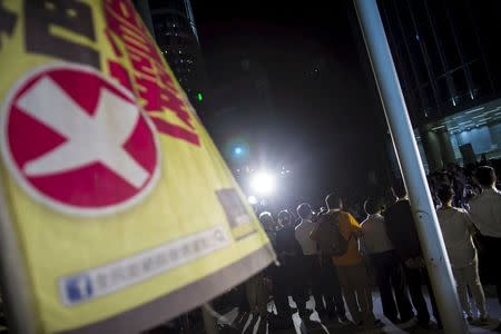 Pro-democracy legislators speak to protesters during a demonstration outside Legislative Council in Hong Kong, China June 17, 2015. REUTERS/Tyrone Siu