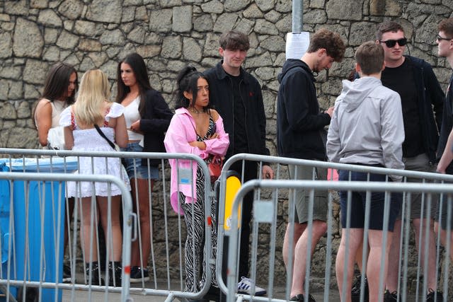 Revellers arrive at Circus nightclub in Bramley-Moore Dock, Liverpool, for a Covid safety pilot event 