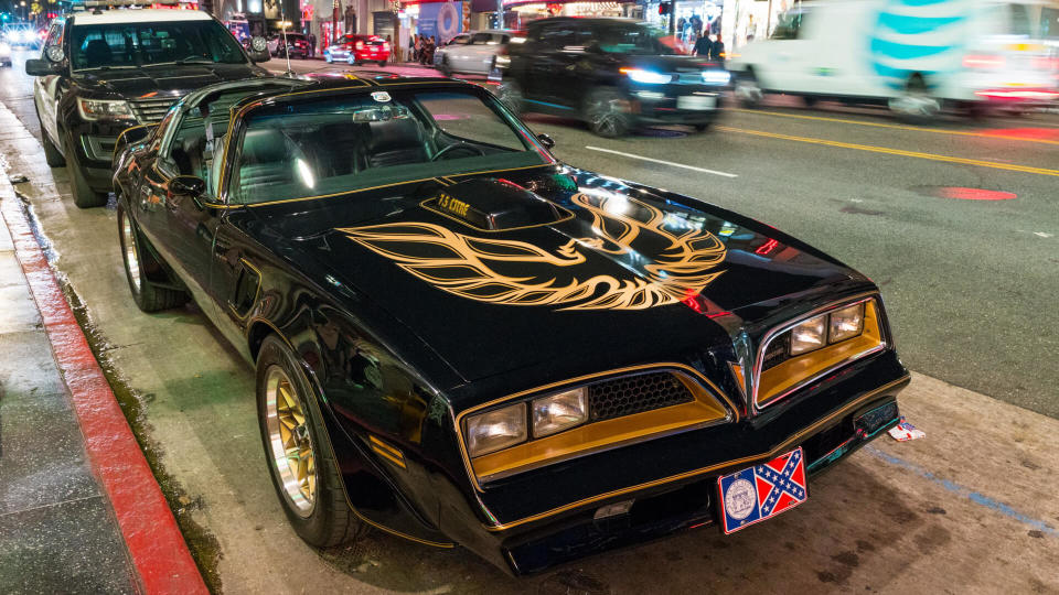 Mandatory Credit: Photo by Shutterstock (9871138f)A replica of the iconic Pontiac Trans-Am from 'Smokey and the Bandit', with a police car behind it, sits parked in front of Burt Reynolds' star on the Hollywood Walk of Fame, in honor of the celebrity after the announcement of his deathTributes to Burt Reynolds, Los Angeles, USA - 06 Sep 2018.