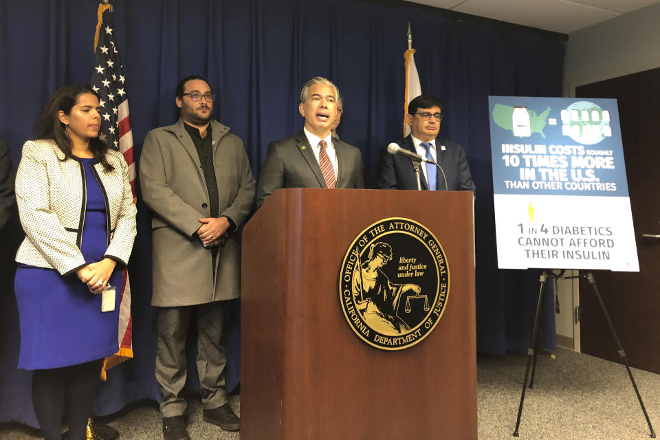California Attorney General Rob Bonta, middle, speaks at a news conference in Sacramento, Calif., on Thursday, Jan. 12, 2023. Bonta announced a lawsuit accusing multiple companies that make or promote insulin of keeping prices too high. (AP photo/Adam Beam)