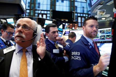 Traders work on the floor of the New York Stock Exchange (NYSE) in New York City, NY, U.S. November 18, 2016. REUTERS/Brendan McDermid