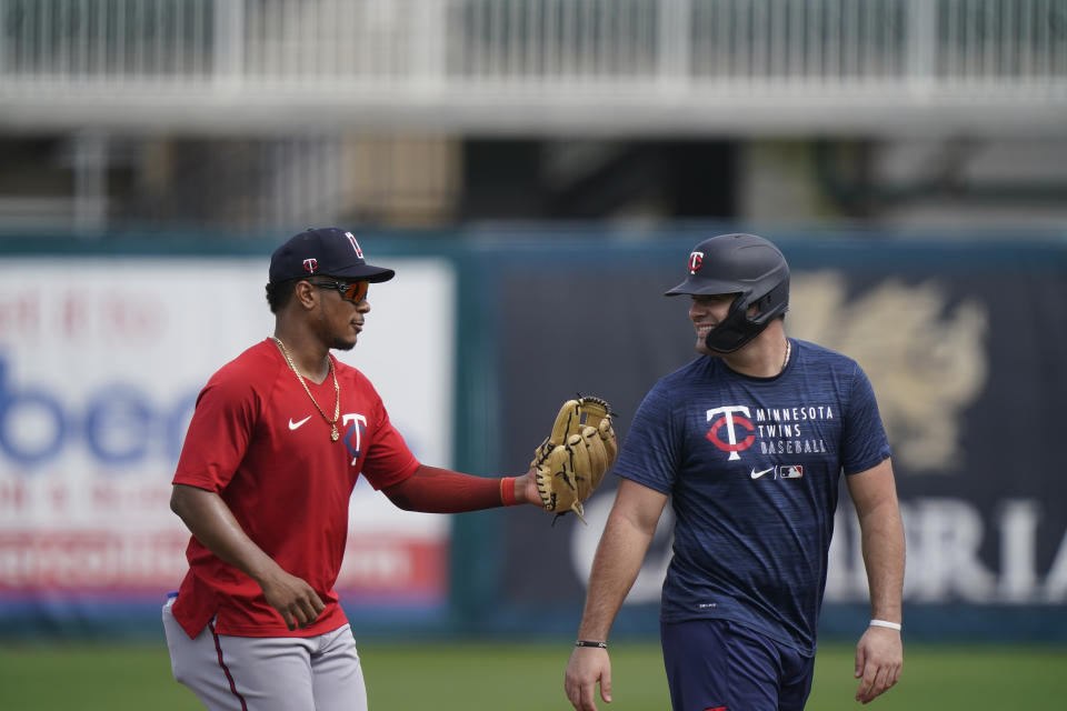 Minnesota Twins shortstop Jorge Polanco, left, tags out another player during spring training baseball practice on Wednesday, Feb. 24, 2021, in Fort Myers, Fla. (AP Photo/Brynn Anderson)