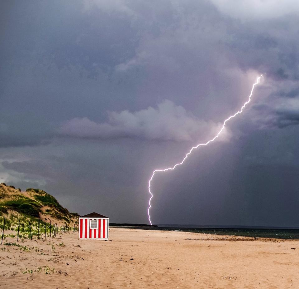 The beach had to be cleared during an intense lightening storm during the National Parks Surf Guard Competion at Brackley Beach. Nick Tweel caught this lightening strike.