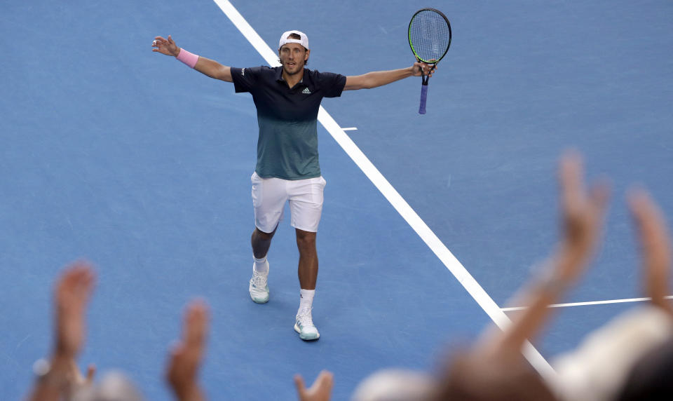 France's Lucas Pouille celebrates after defeating Canada's Milos Raonic in their quarterfinal match at the Australian Open tennis championships in Melbourne, Australia, Wednesday, Jan. 23, 2019. (AP Photo/Mark Schiefelbein)