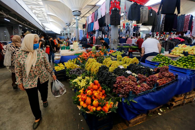 FILE PHOTO: People shop at a local market in Istanbul