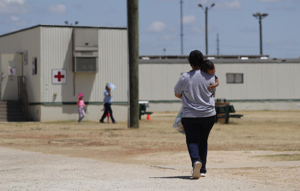 Immigrants seeking asylum walk at the ICE South Texas Family Residential Center on Friday, August 23, 2019, in Dilley, Texas. / Credit: Eric Gay / AP