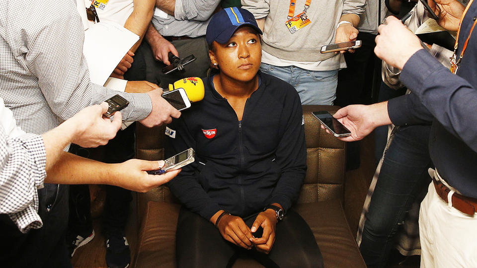 Naomi Osaka fields questions from the media at the Miami Open. (Photo by Michael Reaves/Getty Images)