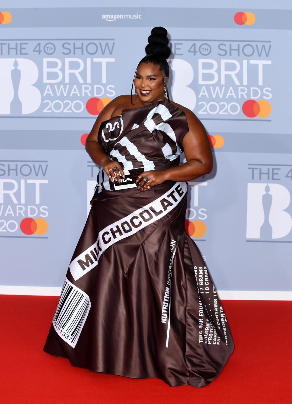 Lizzo wore a chocolate-inspired dress by Moschino to The Brit Awards 2020. (Getty Images) 