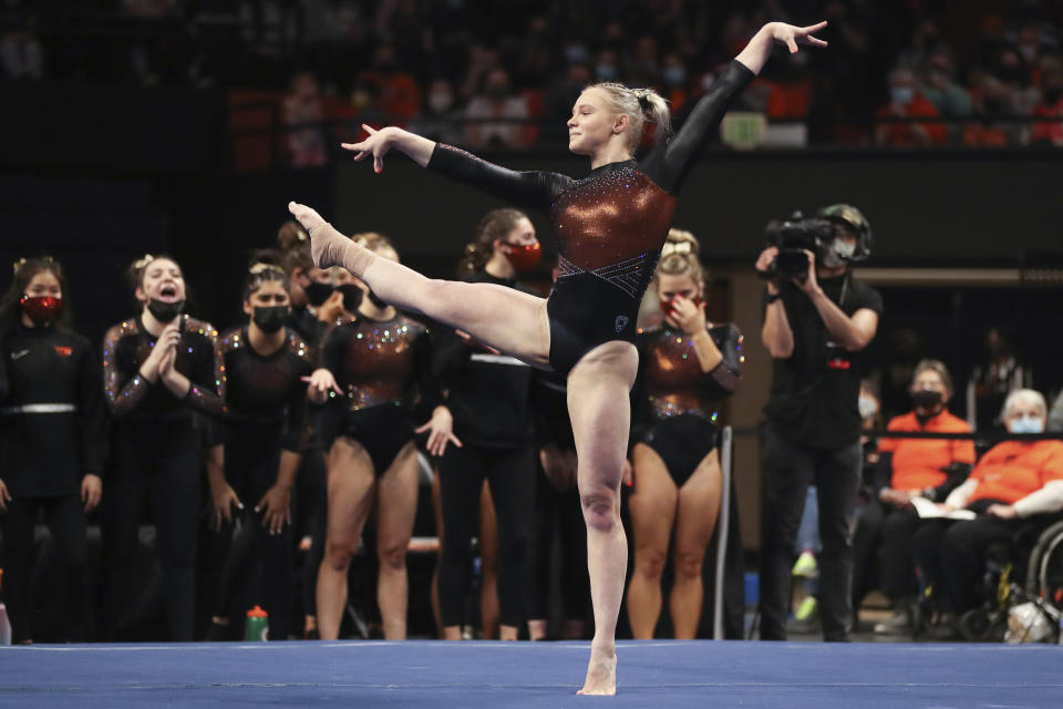 FILE - Oregon State's Jade Carey competes on the floor during an NCAA gymnastics meet against UCLA and UC Davis on Sunday, Jan. 23, 2022, in Corvallis, Ore. Carey is among the leading contenders for the NCAA women’s all-around title, which will be decided on Thursday, April 14, in Fort Worth, Texas.(AP Photo/Amanda Loman, File)