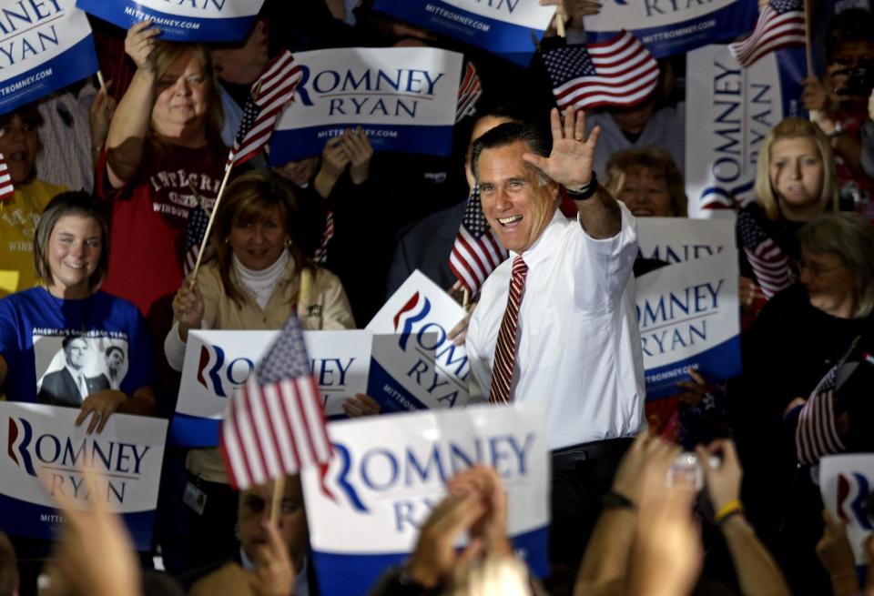 Republican presidential candidate, former Massachusetts Gov. Mitt Romney waves as he takes the stage for a campaign event at a window and door factory, Thursday, Nov. 1, 2012, in Roanoke, Va. (AP Photo/David Goldman)