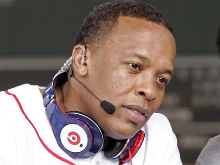 Recording artist Dr. Dre wears a pair of Beats headphones as he attends the MLB 2010 season opener between the New York Yankees and Boston Red Sox at Fenway Park in Boston, in this file photo taken April 4, 2010. REUTERS/Adam Hunger/Files