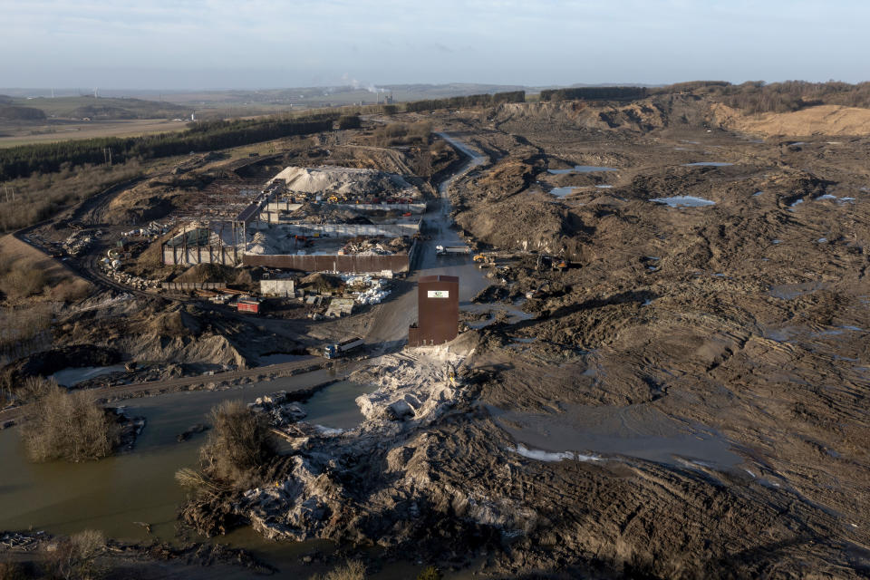 The area affected by a landslide of several million tonnes contaminated soil is pictured, near the village of Oelst, near Randers, Denmark, Thursday Jan. 25, 2024. On Monday, Prime Minister Mette Frederiksen said that "of course, it would be totally unfair if the children in Randers or elderly have to pay this bill,” after visiting the site with a 75-meter (82-yard) tall heap of dirt at the Nordic Waste reprocessing plant site with 3 million cubic meters (3,923,852 cubic yard) of contaminated soil. (Bo Amstrup/Ritzau Scanpix via AP)