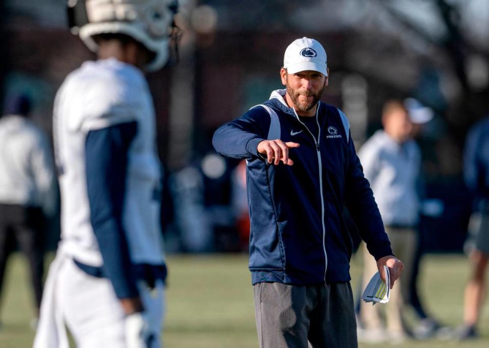 Penn State offensive coordinator Mike Yurcich talks to players during a spring practice on Tuesday, March 21, 2023.