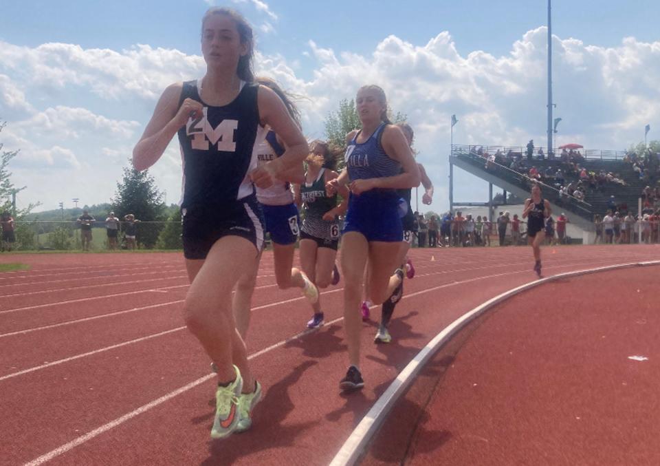 Mercer's Willow Myers, left, leads Villa Maria's Sarah Clark in the Class 2A 3,200-meter run in the District 10 track and field championships at Slippery Rock University on Saturday, May 21, 2022. Clark won the race.