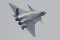 A J-20 stealth fighter jet of the Chinese People's Liberation Army (PLA) Air Force performs during the 13th China International Aviation and Aerospace Exhibition, also known as Airshow China 2021, on Tuesday, Sept. 28, 2021 in Zhuhai in southern China's Guangdong province. (AP Photo/Ng Han Guan)