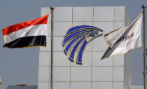 Egypt and EgyptAir flags are seen in front of an EgyptAir in-flight service building, where relatives of passengers who were flying in an EgyptAir plane that vanished from radar en route from Paris to Cairo are being held, at Cairo International Airport, Egypt, May 19, 2016. (Reuters/Amr Abdallah Dalsh)