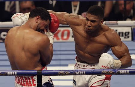 Anthony Joshua in action against Dominic Breazeale. Anthony Joshua v Dominic Breazeale IBF World Heavyweight Title - The O2 Arena, London - 25/6/16. Action Images via Reuters / Henry Browne Livepic