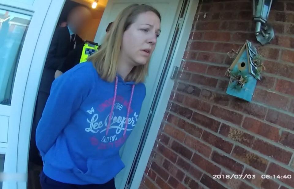 A handout image taken from police bodycam footage released by Cheshire Constabulary police force in Manchester on August 17, 2023, shows the nurse Lucy Letby being arrested at home in Chester on July 3, 2018.